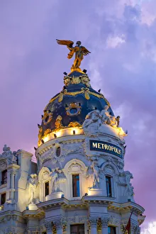 South West Europe Prints: Exterior of Metropolis Building at Dusk, Madrid, Spain