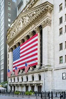 Business Collection: The facade of New York Stock Exchange (NYSE) building adorned with the US flag, Wall Street