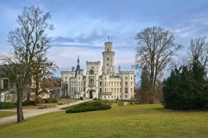 Facade of The State Chateau of Hluboka and its park at dusk, Hluboka nad Vltavou, South Bohemian Region, Czech Republic