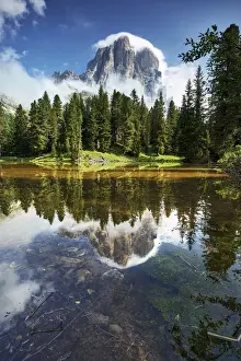Falzarego Pass, Veneto, Italy. The lake Bai de Dones reflects with Tofana di Rozes