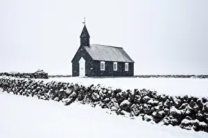 Budir Prints: The famous black wooden church at Budir in a winter blizzard