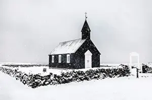 Budir Prints: The famous black wooden church at Budir in a winter blizzard