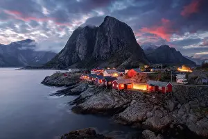 Reine Prints: The famous red cabins of Hamnoy catching the last light of the day on a explosive summer sunset