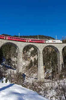 Images Dated 21st April 2017: The famous red train of Albula mountain railway while passing on the Landwasser viaduct