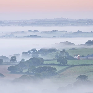 Farmhouse Prints: Farmhouse and mist covered countryside, Stockleigh Pomeroy, Devon, England. Autumn