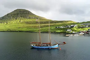 Foroyar Prints: The Faroese-built wooden sailship Norðlysið (The Nordic Lights) sailing in fron of the village of Syðrugota