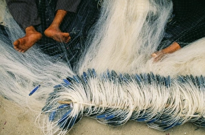 Indo China Gallery: Detail of feet being used to repair fishing