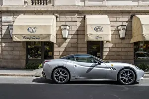 Ferrari car parked in front of the historic Cova coffehouse located in Via Montenapoleone