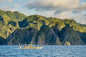 Calamianes Prints: Filipino outrigger fishing boat and dramatic karst landscape of Coron Island, Palawan