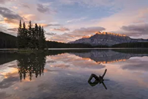 First light illuminates Mount Rundle, and reflects in Two Jack Lake, Banff National Park