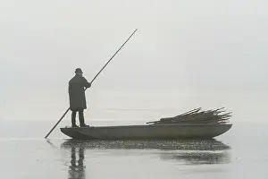 Poles Prints: Fisherman on boat preparing for fish harvest on foggy morning