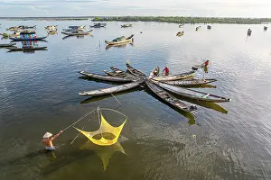Fishing Net Prints: Fisherman collecting fish with traditional nets