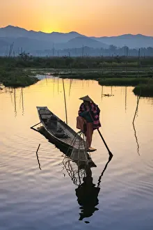 Intha Prints: Fisherman fishing using typical conical net at sunrise, Floating Gardens, Lake Inle