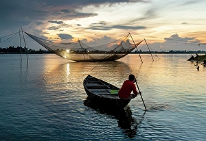 Hoi An Prints: Fisherman heading out to check his net at sunrise