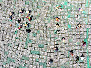 Straight Down Prints: Fishermen collecting anchovies from drying racks, Tuy An, Phu Yen Province, Vietnam