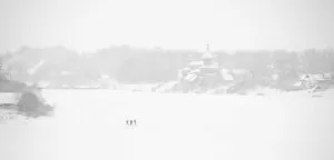 Pilgrimage Gallery: Fishermen on the frozen Volkhov River with Nikolsky monastery in the background, Staraya
