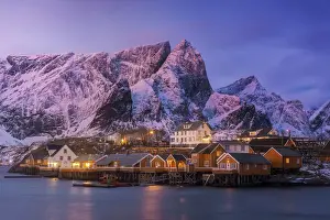 Reine Prints: Fishermens cabins (rorbuer) of Sakrisoy along the coast at sunrise in the Lofoten