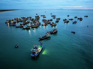 Quang Nam Province Prints: Fishing boat at dusk, Tam Tien, Quang Nam Province, Central Vietnam