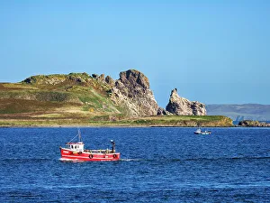 Fishing boat and Ireland's Eye Island, Howth, County Dublin, Ireland