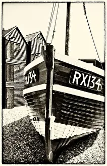 A fishing boat and the net shops ( a weather-proof storage for the fishing gear)