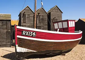 A fishing boat and the net shops ( a weather-proof storage for the fishing gear)