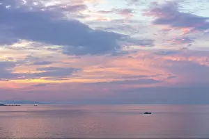 Fira Prints: Fishing boat on the ocean at sunrise, Fira, Santorini, Cyclades Islands, Greece, Europe