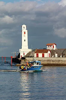 Basque Prints: A fishing boat passes the lighthouse at Saint-Jean-de-Luz