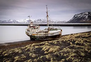 Black Sand Prints: Fishing boat stranded on black sand beach near Rif, Snaefellsnes Peninsula, Iceland