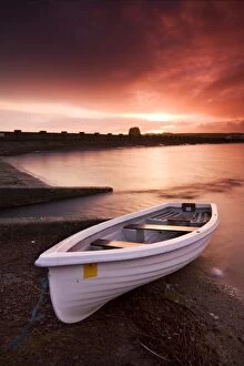 Powys Gallery: Fishing boat tethered on the shores of the Usk Reservoir at sunrise, Brecon Beacons National Park