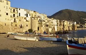 Cefalu Gallery: Fishing boats pulled up on the beach outside the old town at sunset