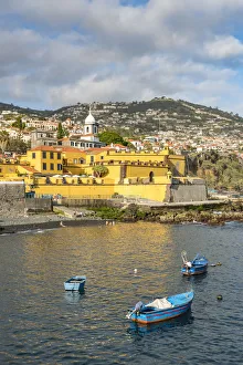 Fishing boats and Sao Tiago fortress. Funchal, Madeira Island, Portugal