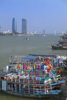 Images Dated 11th June 2014: Fishing boats on Song River and city skyline, Da Nang, Vietnam