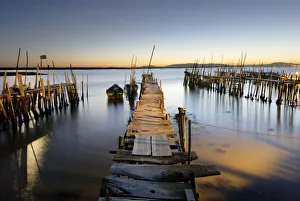 Fishing palafitte harbour of Carrasqueira at dusk. Alentejo, Portugal