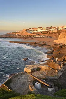 Cannon Prints: The fishing village of Ericeira at dusk, overlooking the Atlantic Ocean. Portugal
