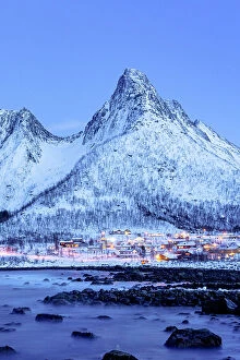 Images Dated 20th September 2023: Fishing village of Mefjordvaer and snowy mountains at dusk, Senja, Troms county, Norway