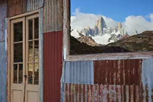 The Fitz Roy mountain mirrored on the window of the Estancia Bonanza mountain retreat