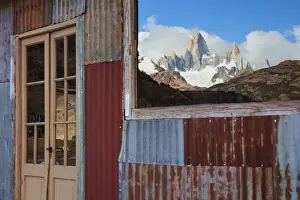Mirrored Prints: The Fitz Roy mountain mirrored on the window of the Estancia Bonanza mountain retreat