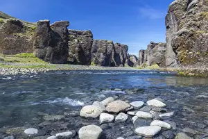Sudurland Prints: Fjadra River flowing through rocks against cliffs in Fjadrargljufur canyon on sunny day