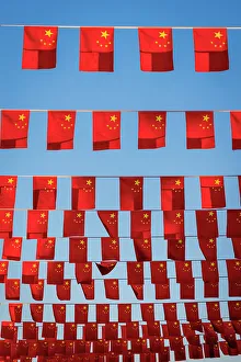 City Street Prints: Flags displayed on city street, Beijing, China