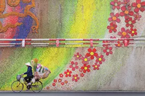 Hanoi Prints: Flower seller with her bicycle by the famous ceramic flower mural