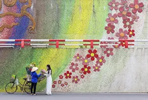 Hanoi Prints: Flower seller and local woman at ceramic flower mosaic mural, Hanoi, Vietnam