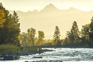 Peter Adams Prints: Fly fisherwoman & fisherman casting & fishing on river, British Columbia, Canada