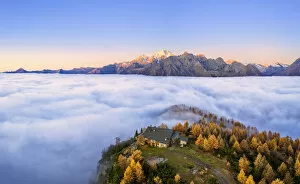 Images Dated 29th April 2020: Fog covers the Valmalenco(Val Malenco) with the mountain range of Disgrazia illuminated