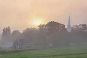 Autumn Leaf Prints: Foggy sunrise over white-steeple church and red barn