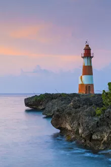 Folly Point Lighthouse illuminted at dusk, Port Antonio, Portland Parish, Jamaica