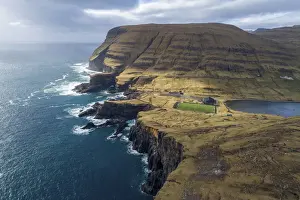 High Altitude Prints: Football field in Vagur close to the cliffs on the west coast of Suðuroy. Faroe Islands