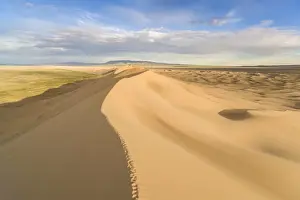 Footsteps on Khongor sand dunes in Gobi Gurvan Saikhan National Park. Sevrei district