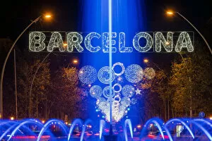 Images Dated 4th February 2021: Fountain and Christmas lights in Gran Via avenue, Barcelona, Catalonia, Spain