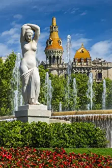 Fountain in Plaza Catalunya with Casa Rocamora modernist building behind, Barcelona