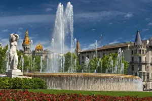 Fountain in Plaza Catalunya with Casa Rocamora modernist building behind, Barcelona